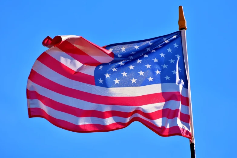 a flag of the united states waving in the wind