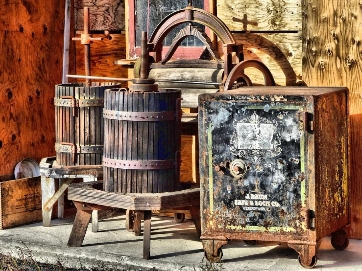 a wooden box with wheels and other objects sitting next to it