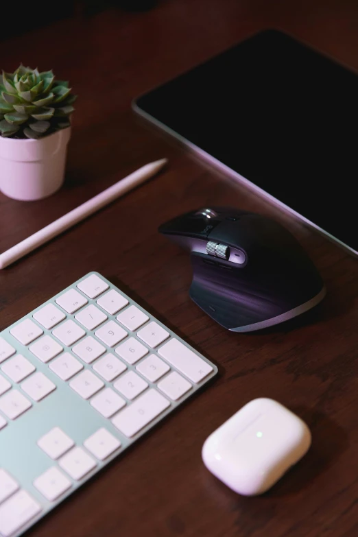 a keyboard and mouse sitting on top of a wooden desk