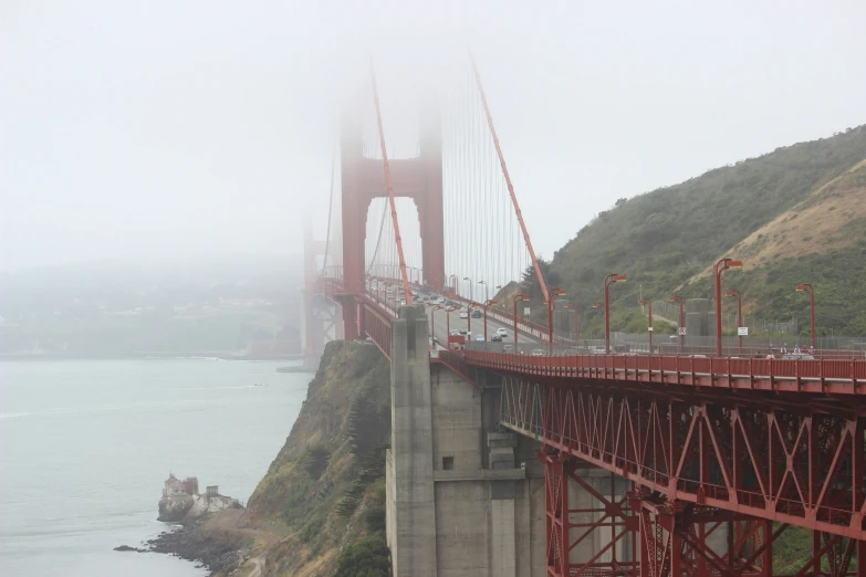 a bridge with a few people going over the bridge