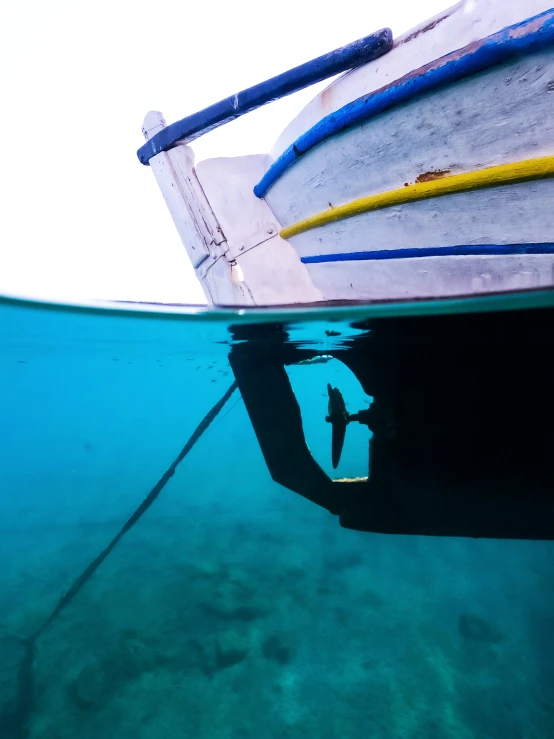 a boat floats on the ocean near shore