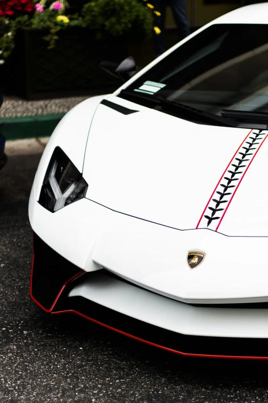 a sports car with a racing stripe is seen