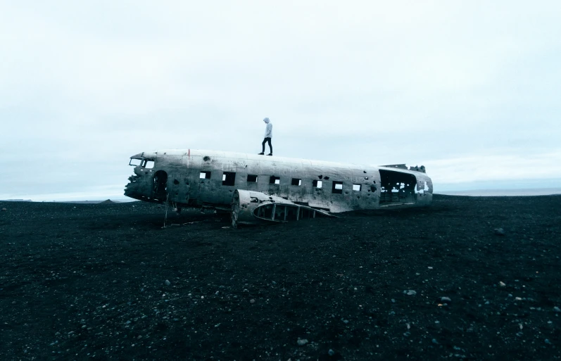 a large airplane is parked on the side of the field