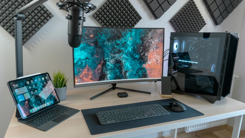 a monitor, keyboard and mouse on a desk