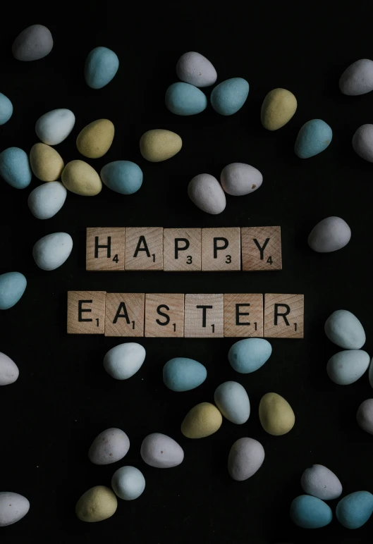 a word made of wooden blocks in the shape of words that read happy easter
