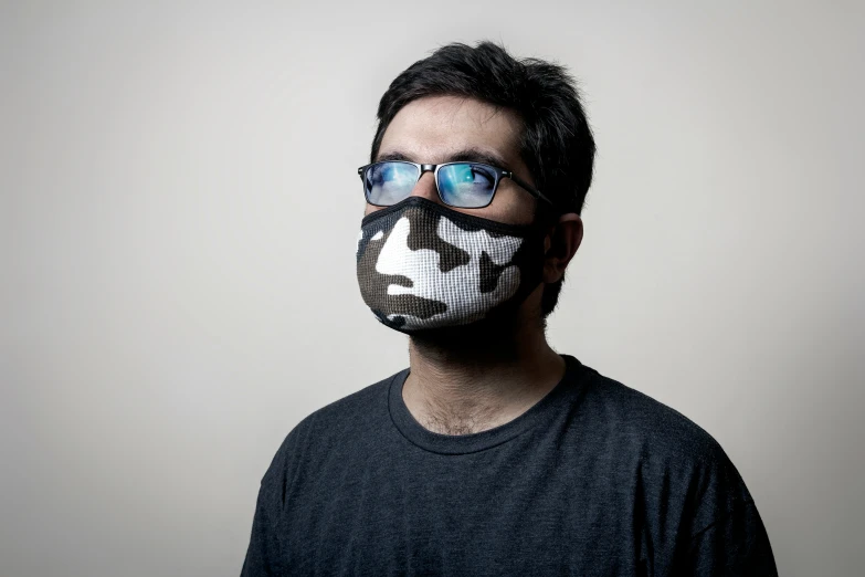 man with fake gas mask over his face is wearing sunglasses