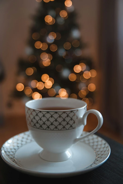 the coffee cup and saucer are sitting on the table