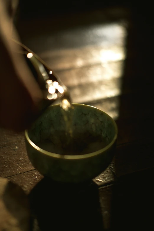 a small bowl and spoon sitting on a floor