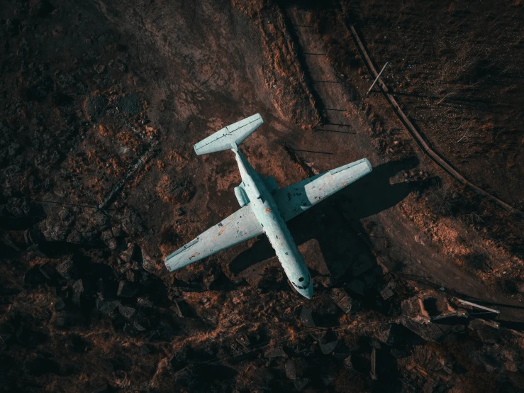an aerial view of an airplane in the field