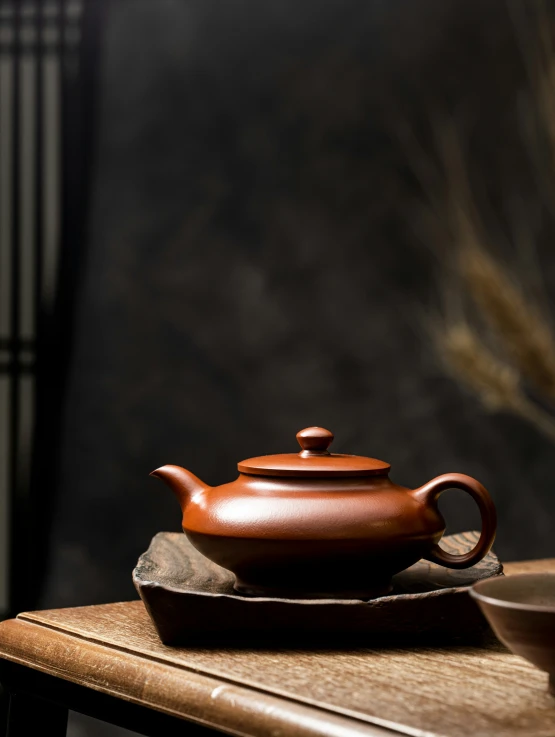 a teapot on top of a wooden table
