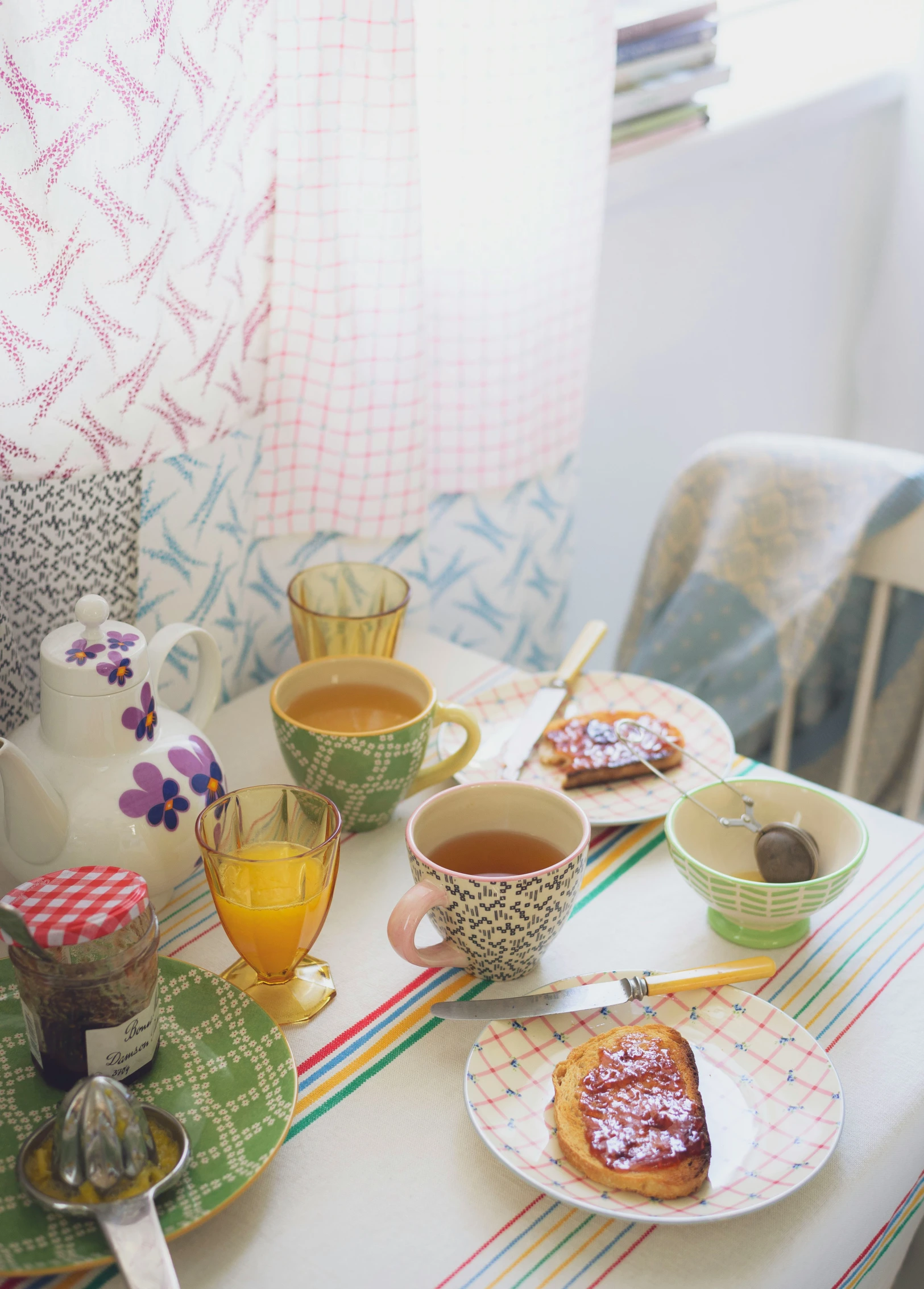 breakfast foods are prepared and on table next to chairs