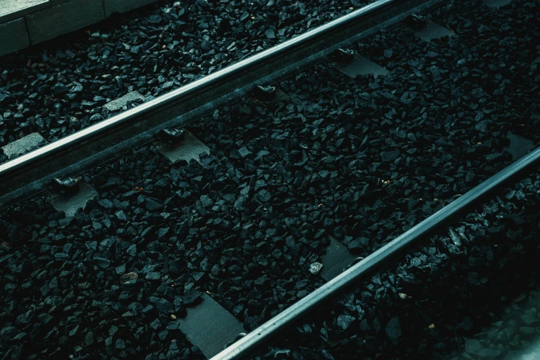 two parallel rail lines are shown on the sidewalk