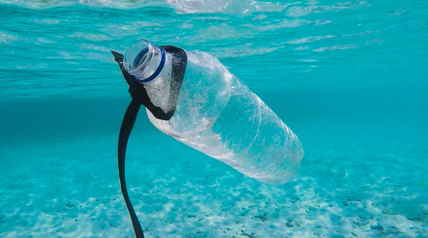 a water bottle being lifted in the air to remove it from its surface