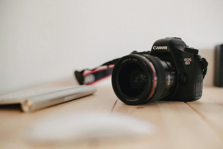 a camera and other equipment are sitting on the floor