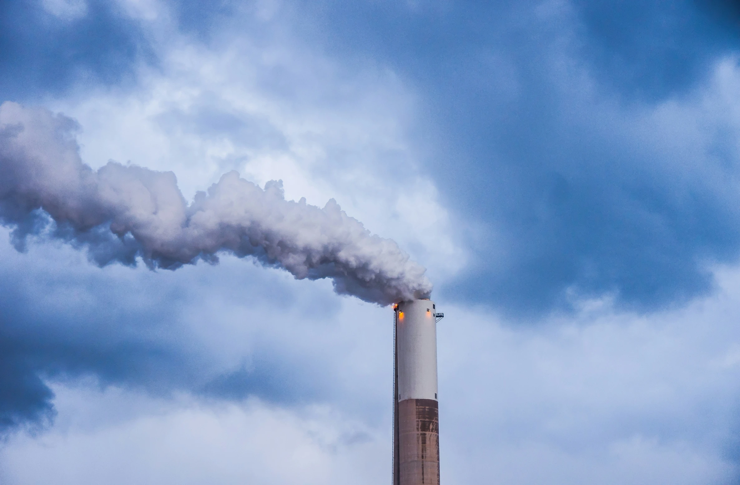 a black smoke stack coming out of a building