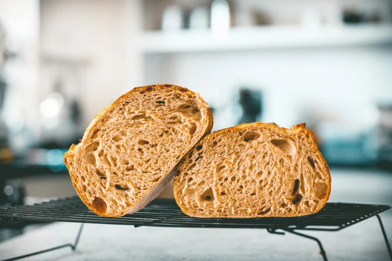 two pieces of bread are placed on a wire rack