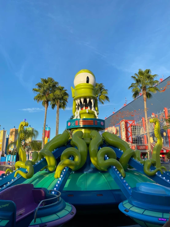 an inflatable monster ride is shown on a sunny day