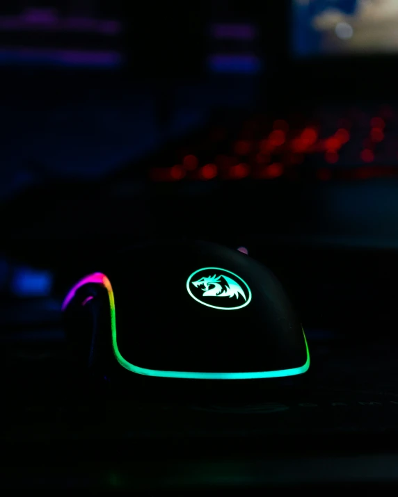 a computer mouse with neon colors lit on the side