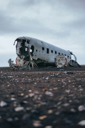an old, rusty airplane sits on the ground