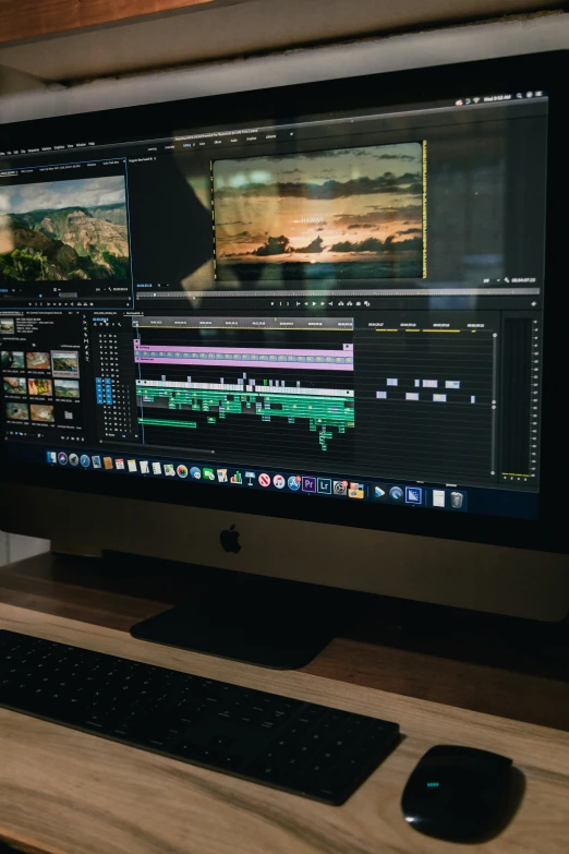 a computer monitor is on a table, with a keyboard and mouse in front of it