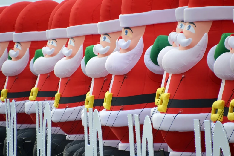 a parade float featuring santa clause head