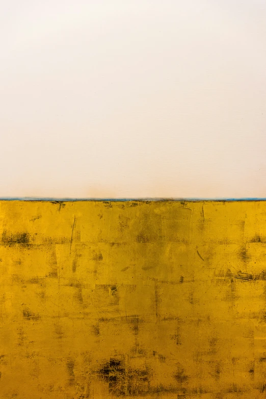 an empty wall in front of a yellow and white background