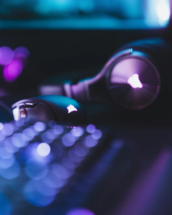 computer keyboard sitting at night time with many colored lights