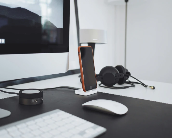 there is a phone and headset on the desk