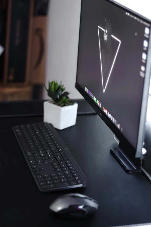 a desktop computer sitting on top of a black desk