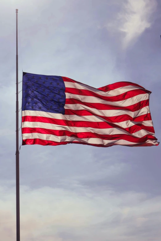 an american flag waving in the wind