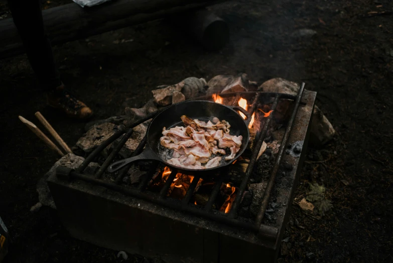 a set is cooking food over a grill