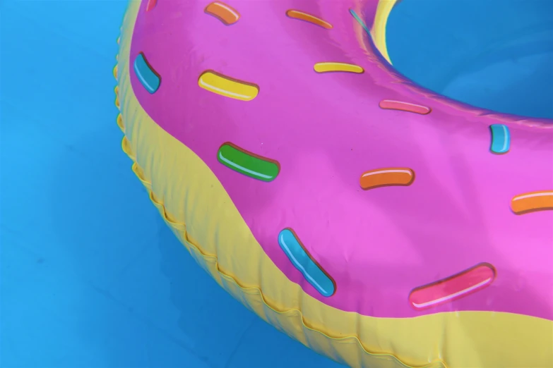 a large pink doughnut inflatable swimming ring