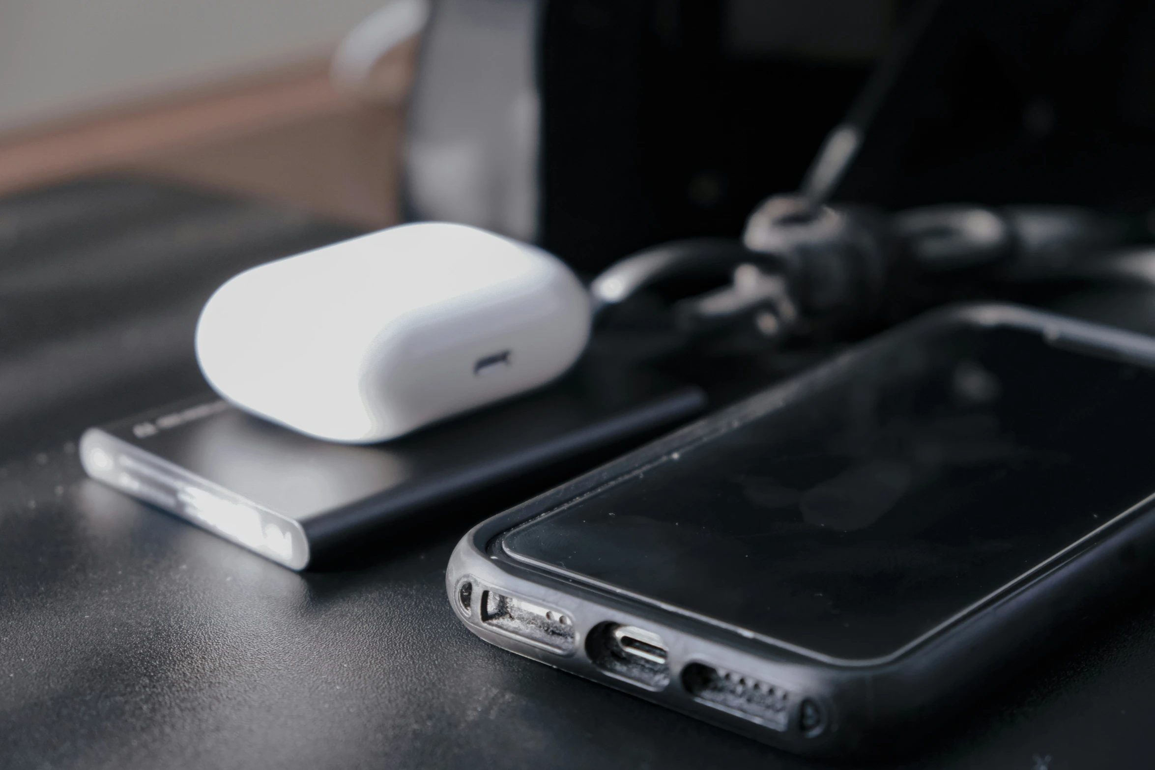 a white cell phone sitting next to an empty cellphone