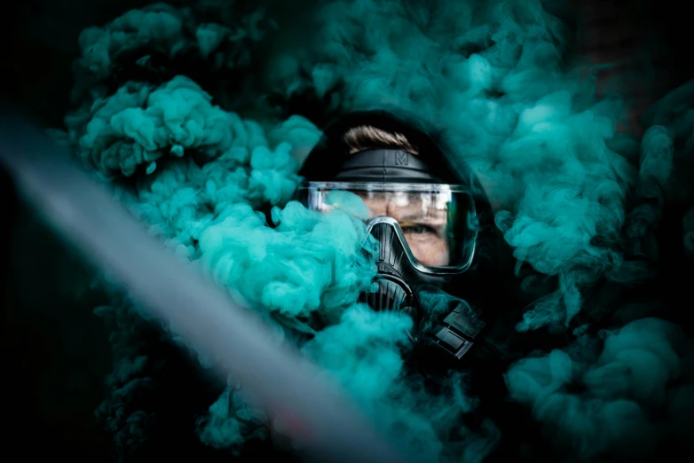 a man wearing a helmet and gas mask