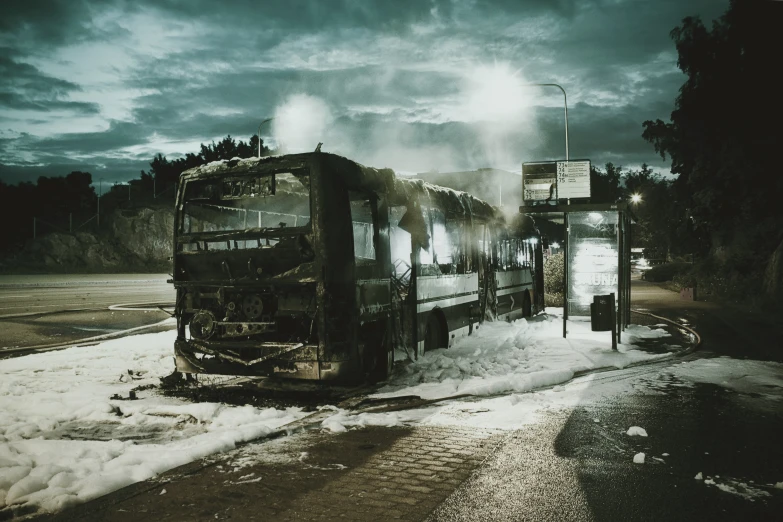 an abandoned bus is sitting in the snow