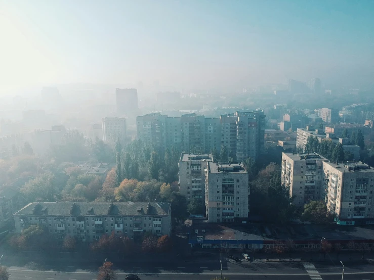 a city skyline with skyscrs, houses and trees