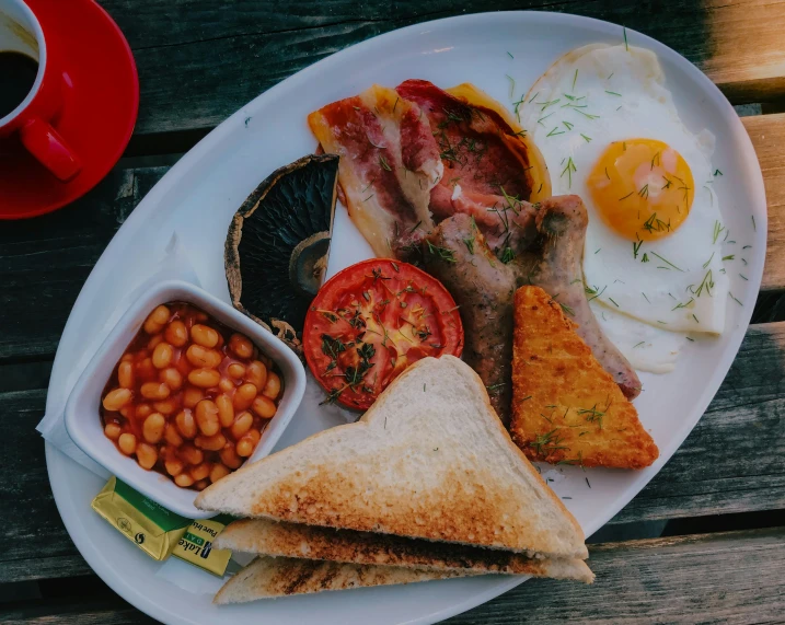 the breakfast is prepared on a plate on a picnic table
