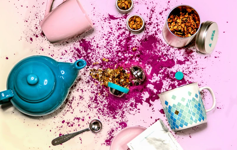 various items sitting in a pile on top of a pink table