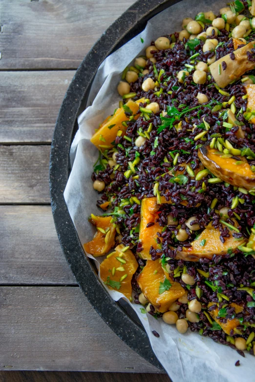 a bowl filled with grains and vegetables