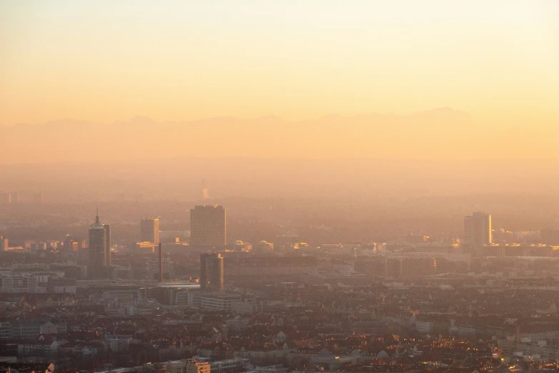 a skyline view of a city, looking towards the mountains