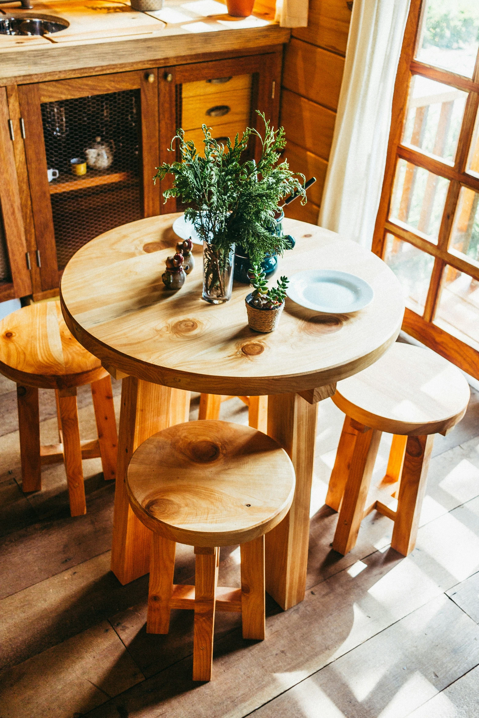 a table that has flowers and other objects on it