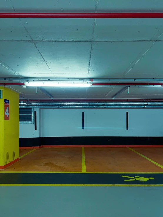 a yellow box is in an empty parking garage