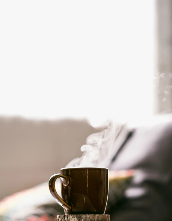 coffee cup on a table that is being smoke filled