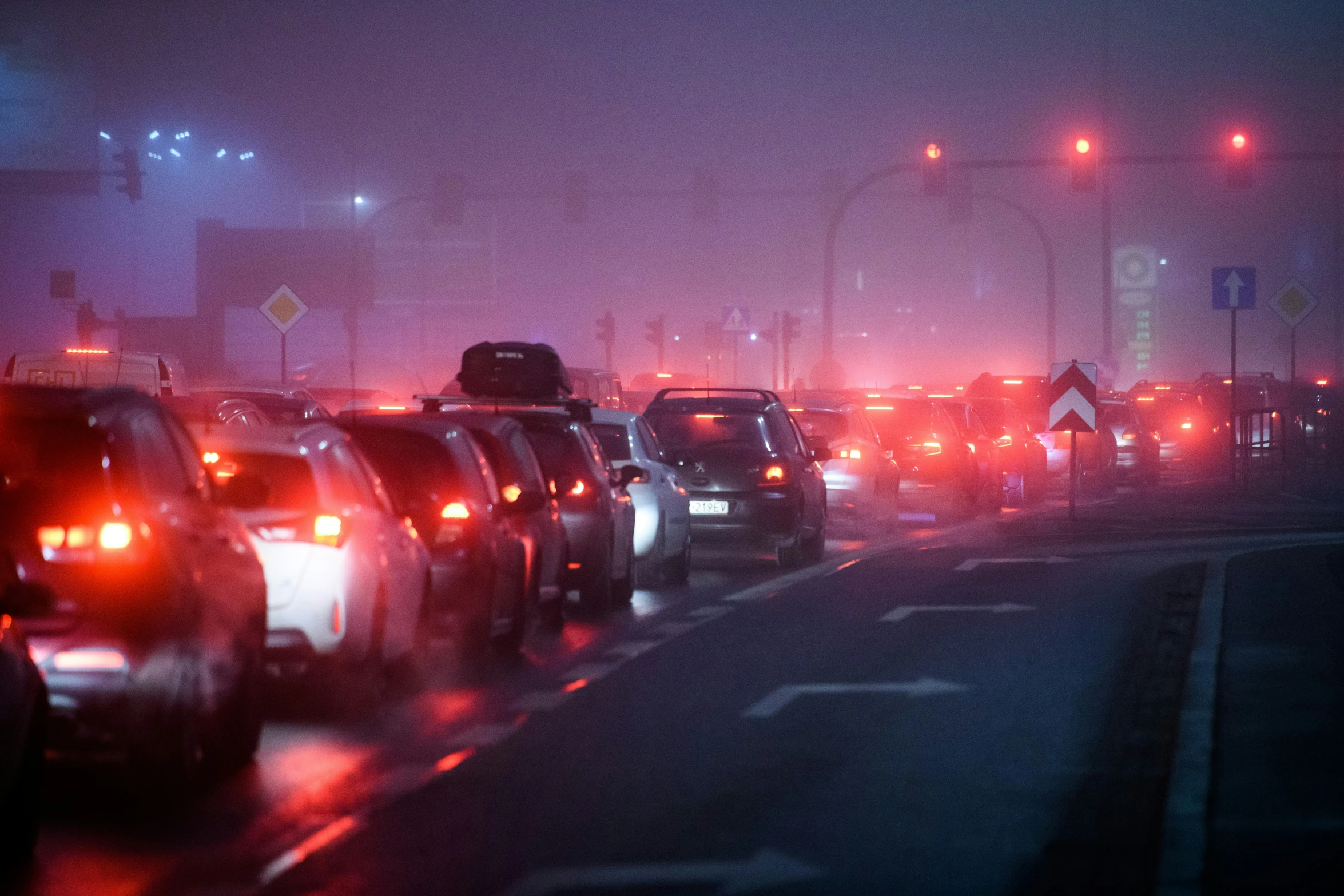 heavy traffic at night in an industrial city