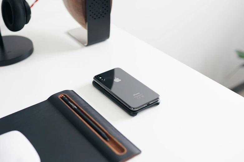 two phones sitting side by side on a desk