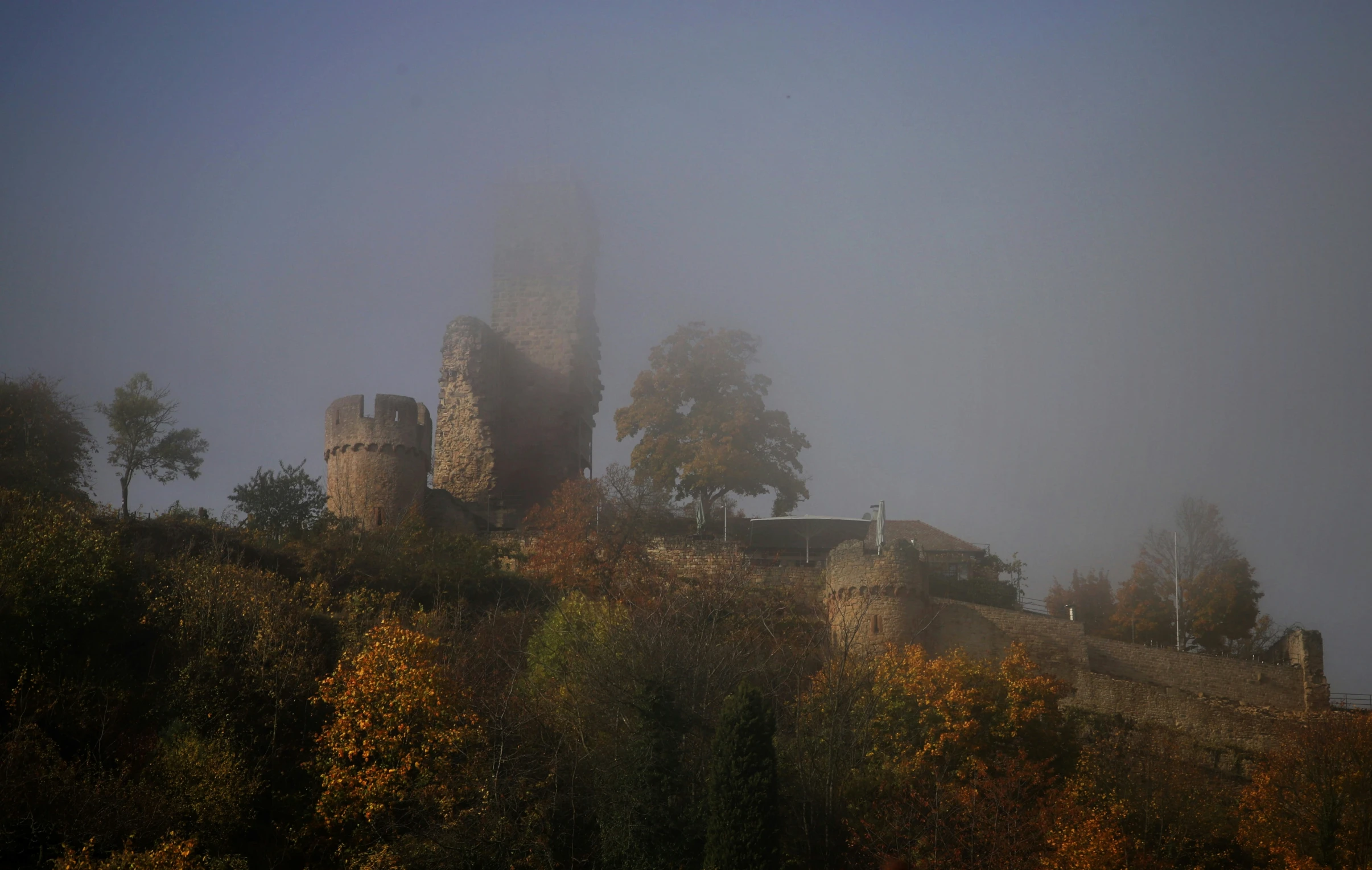 a very tall castle sitting on top of a hill