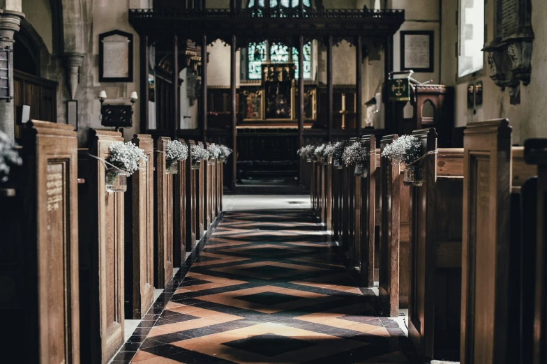 a small chapel with pews is empty