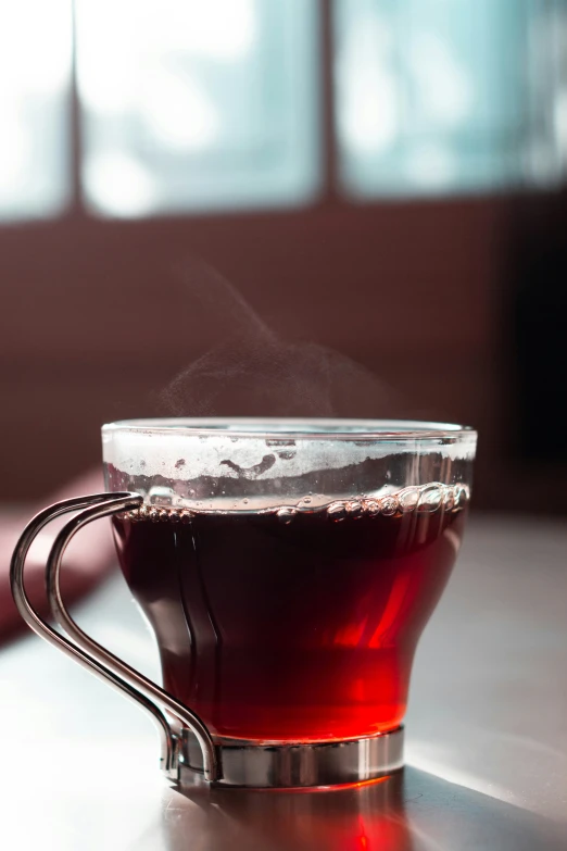 a close up of a cup with a steamy substance