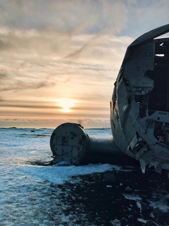 a helicopter sitting on top of an ice covered field