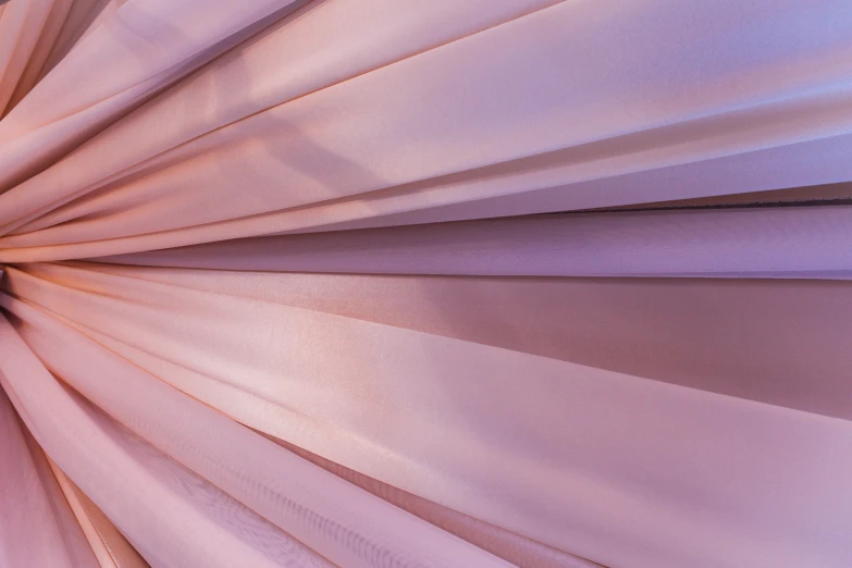 a closeup view of a pink color wall paper